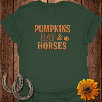 Dark green t-shirt with "Pumpkins Hay & Horses" text and autumn decorations.