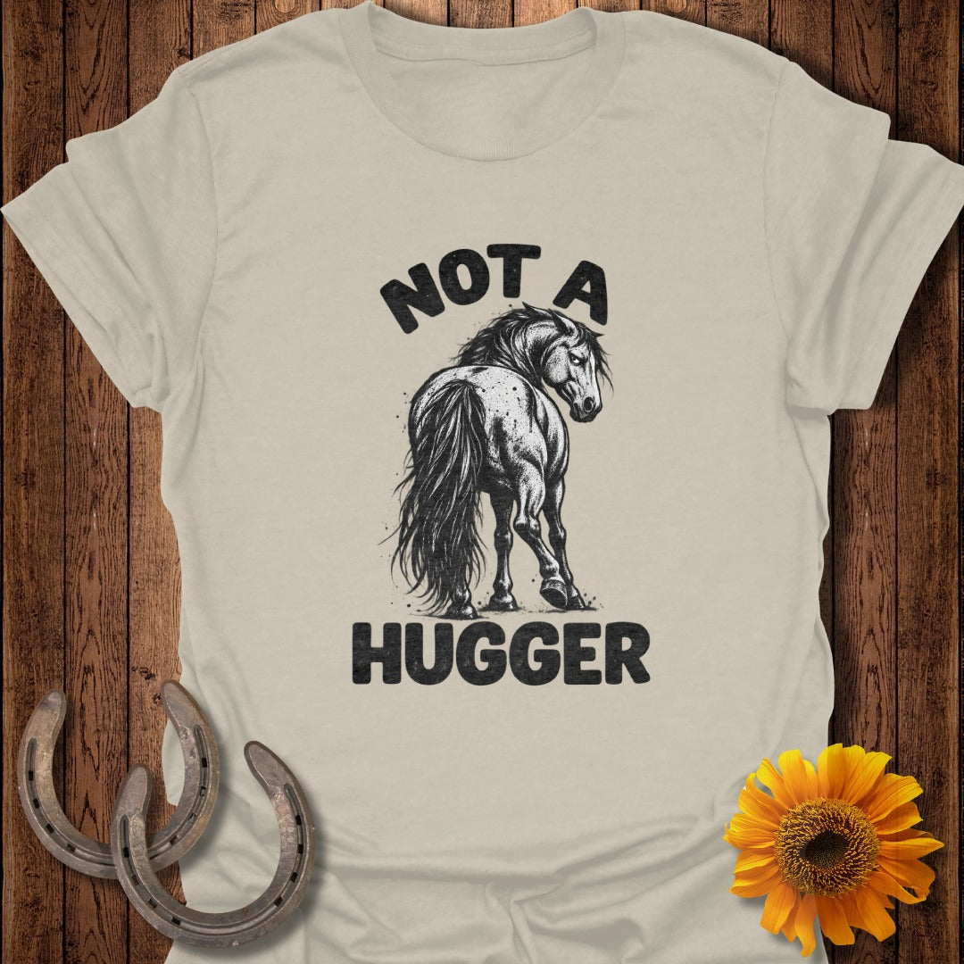 Beige t-shirt featuring a black graphic of a horse looking back with the text NOT A HUGGER.