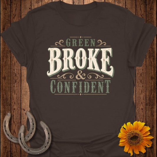 Brown t-shirt with "Green Broke & Confident" text, horseshoes, and sunflower.