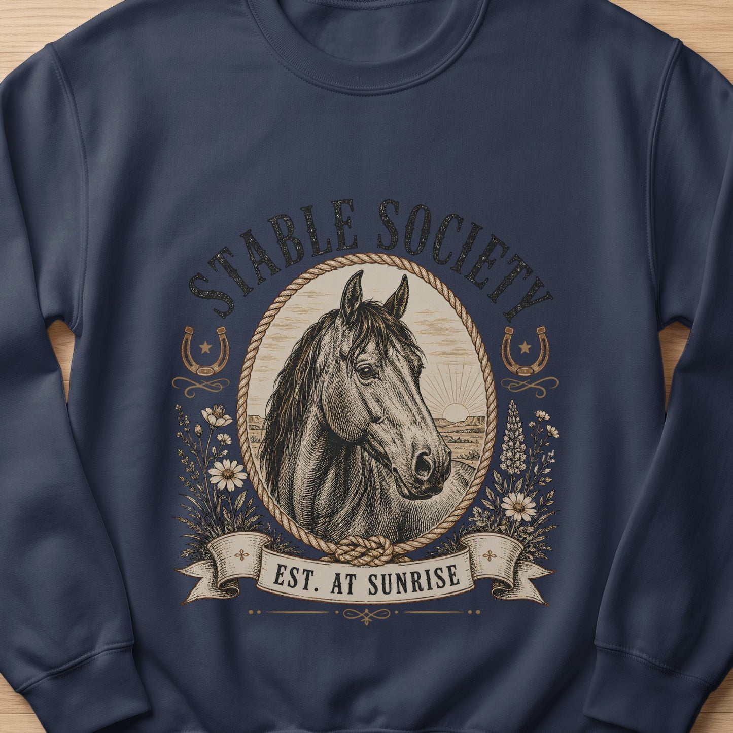 Dark blue sweatshirt with a vintage horse design and text "STABLE SOCIETY EST. AT SUNRISE".