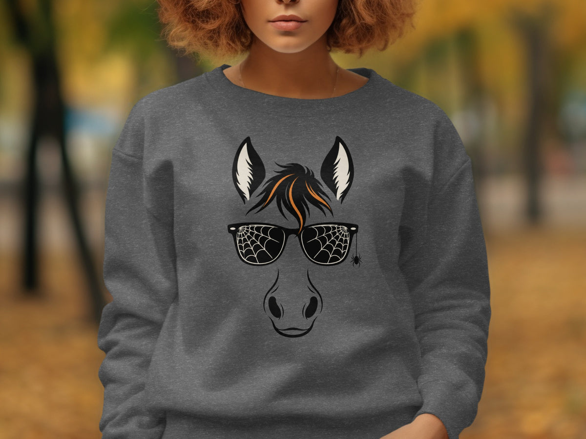 Dark grey sweatshirt with a horse face graphic featuring spiderweb sunglasses and a hanging spider.
