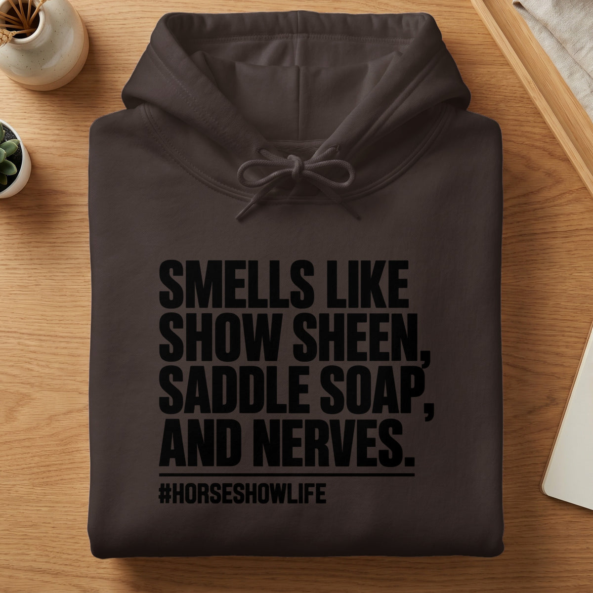 Brown hoodie with "Smells Like Show Sheen, Saddle Soap, and Nerves. #HorseShowLife" text.