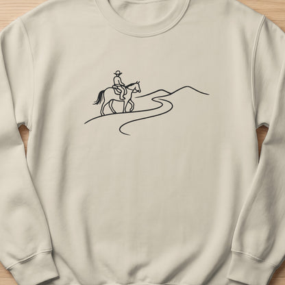Line art of a person on horseback riding along a winding path in the hills.
