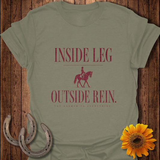 Olive green t-shirt with maroon text and equestrian graphic.