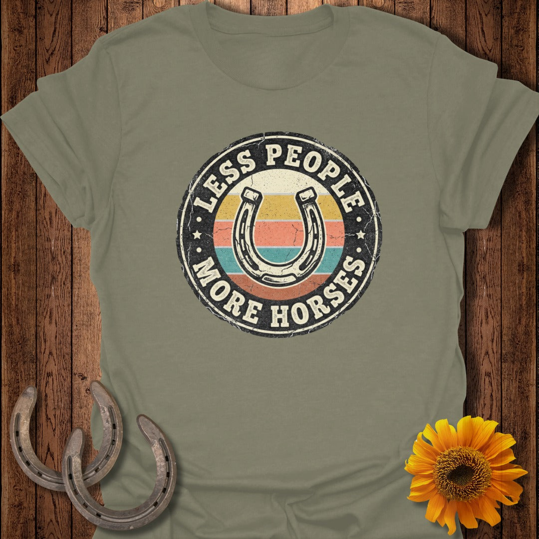 T-shirt with "Less People More Horses" text and horseshoe graphic.