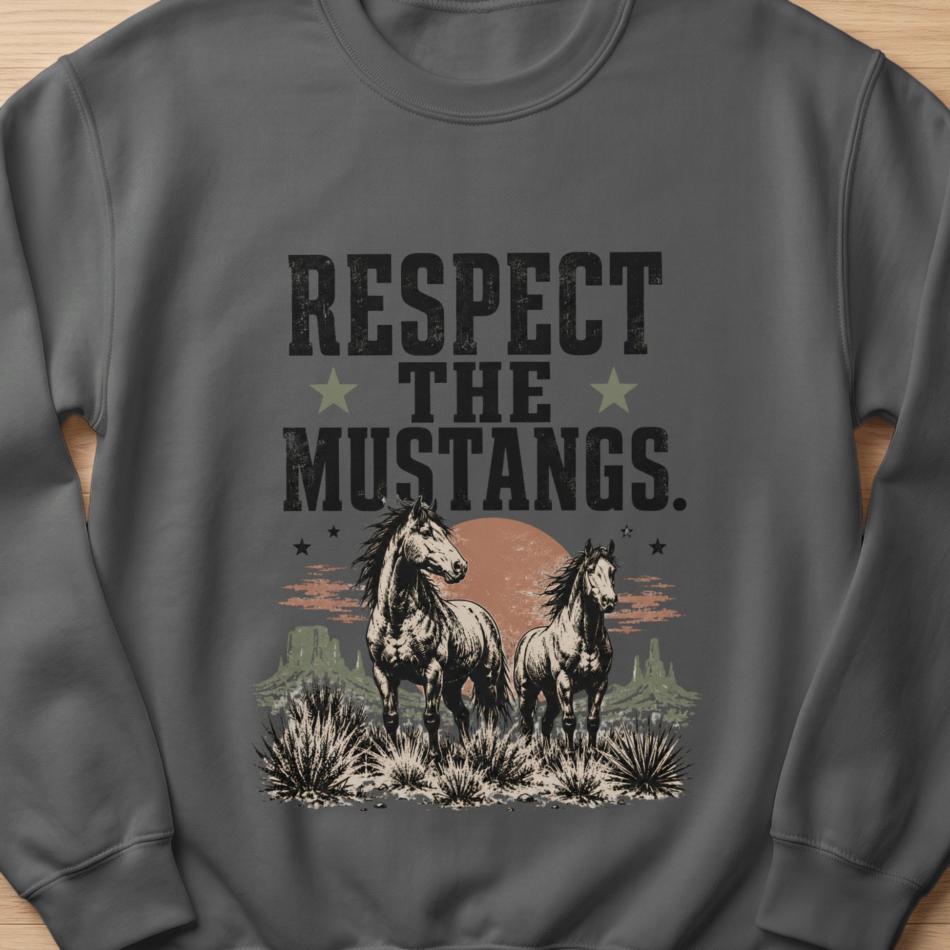 Dark grey sweatshirt featuring a desert scene with two horses and the text "RESPECT THE MUSTANGS".