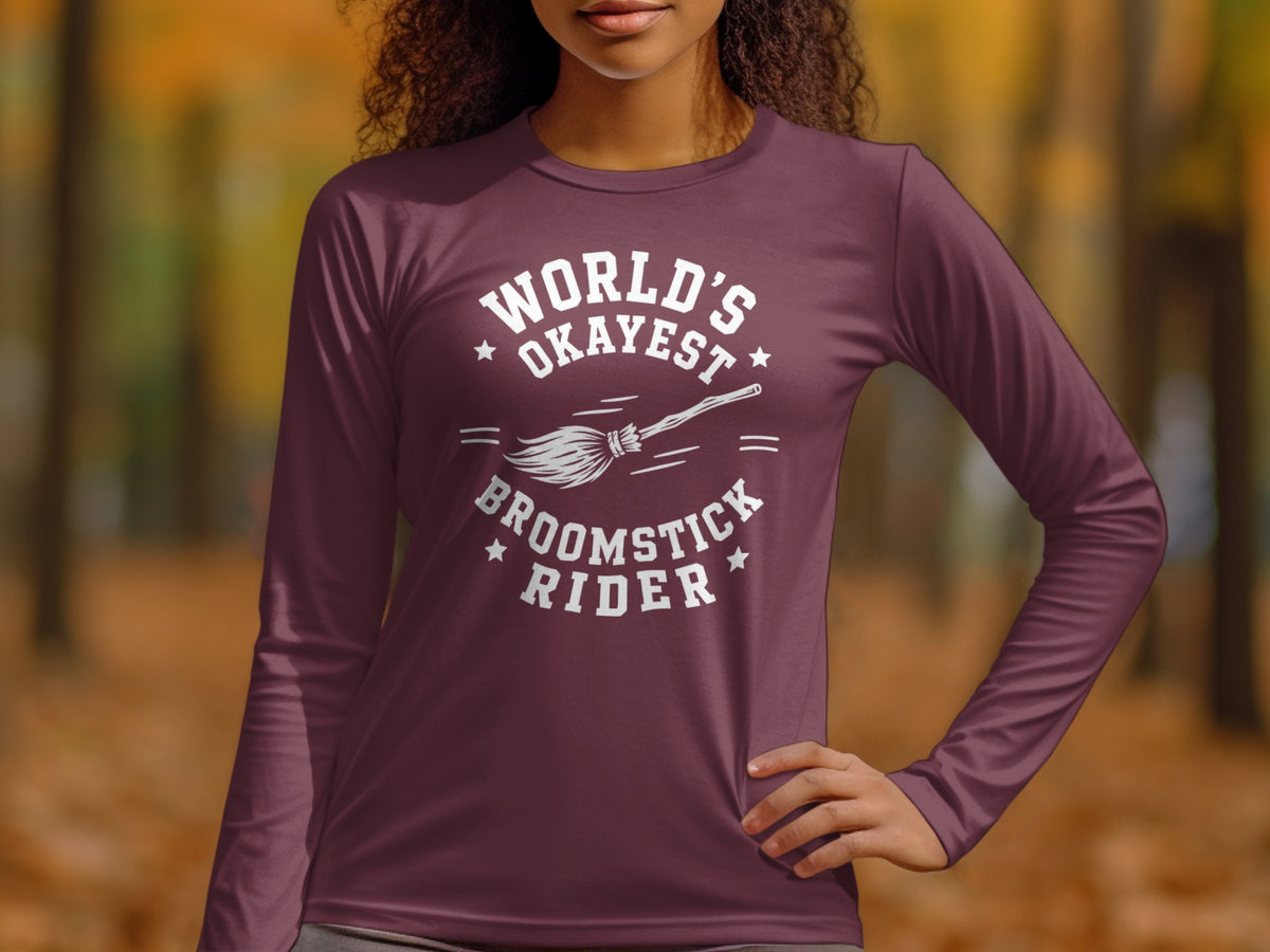 Maroon long-sleeve shirt with "World's Okayest Broomstick Rider" graphic.