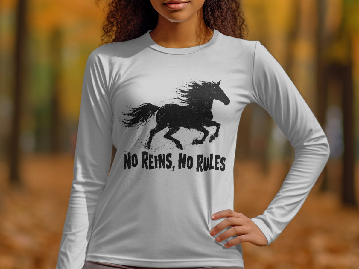 White long-sleeved shirt with a black silhouette of a galloping horse and "NO REINS, NO RULES" text.