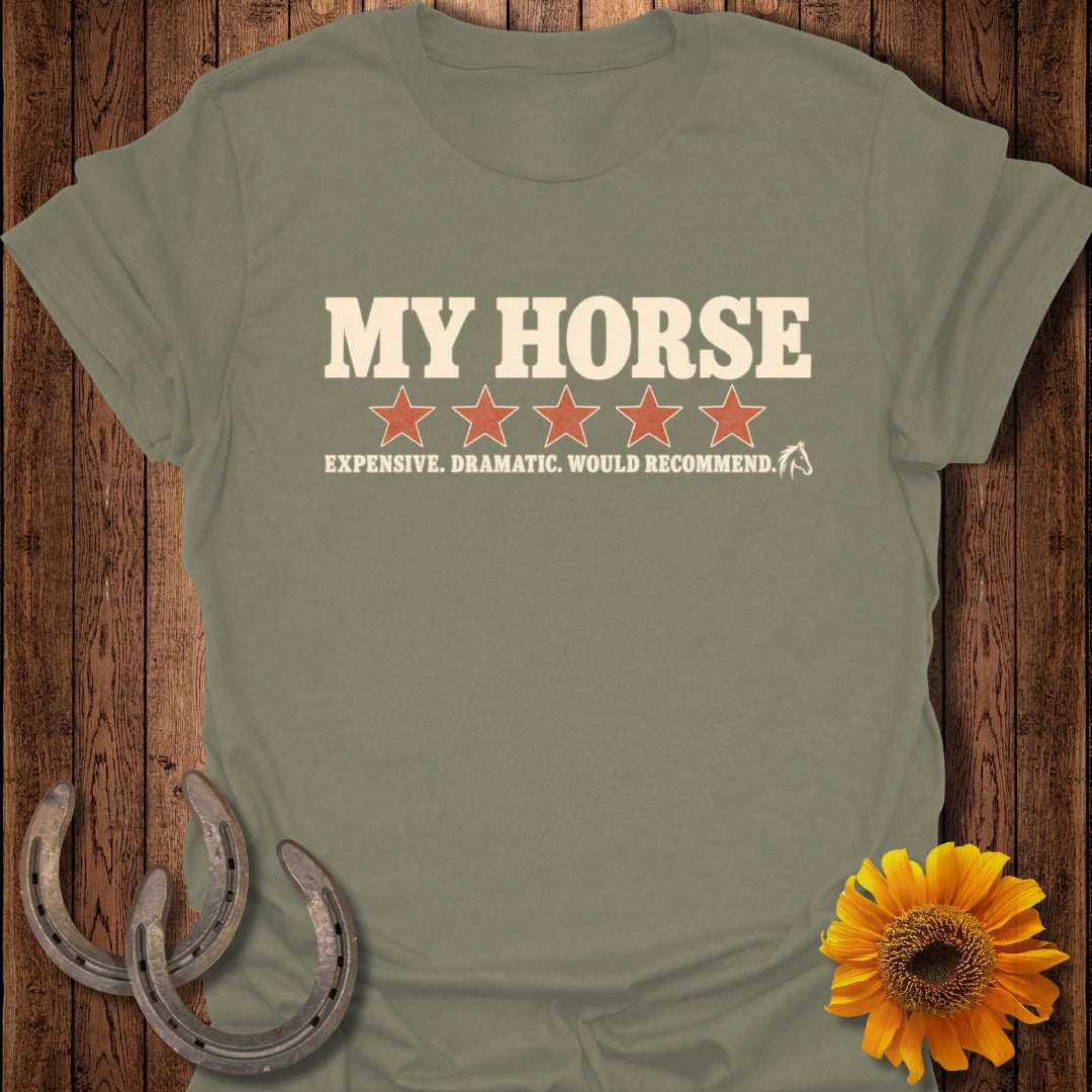 An olive green t-shirt featuring the text MY HORSE above five red stars and the text EXPENSIVE. DRAMATIC. WOULD RECOMMEND.