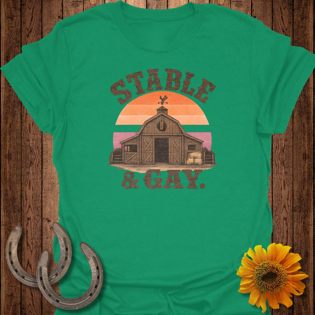 Green t-shirt with barn and sunset graphic reading "Stable & Gay".