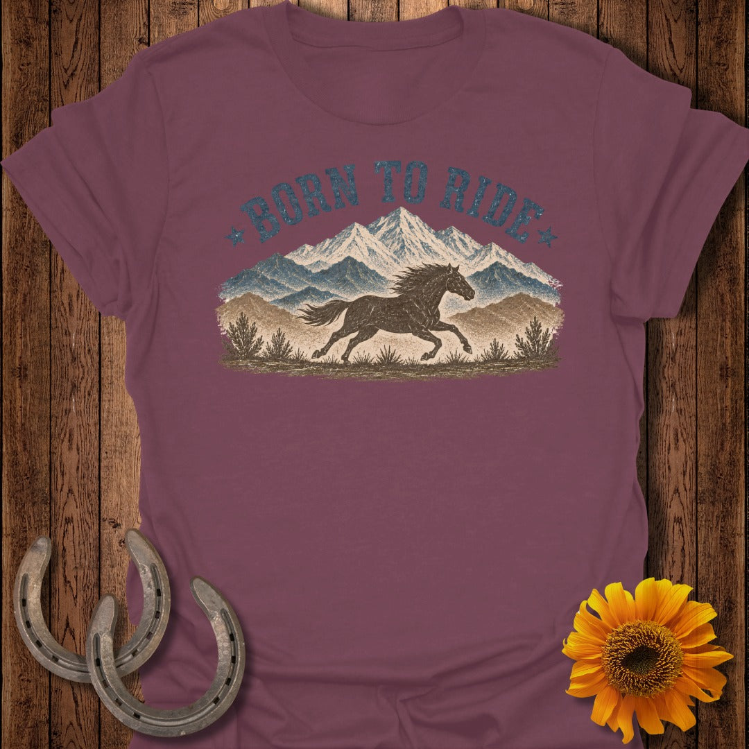 Maroon t-shirt with "BORN TO RIDE" text over a running horse and mountains.