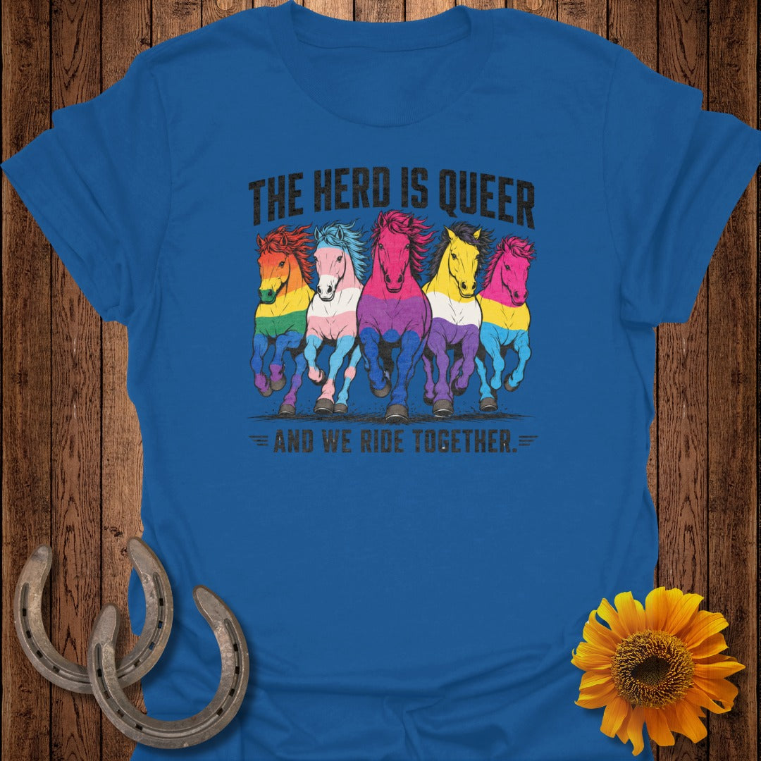 Five horses with rainbow manes on a blue t-shirt, text reads "The Herd is Queer".