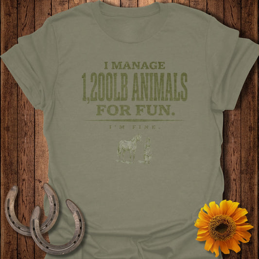 Olive green t-shirt with "I manage 1,200lb animals for fun" graphic.