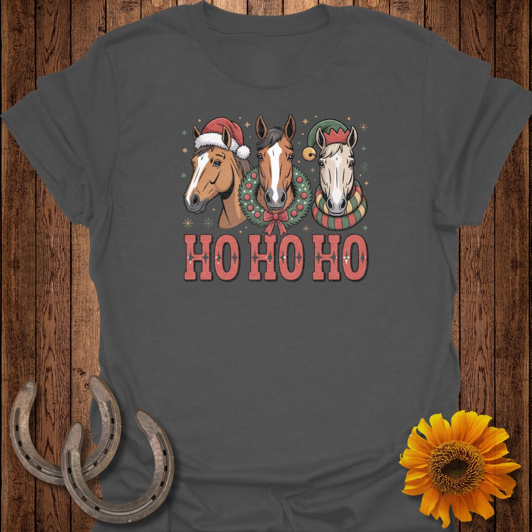 Three horses wear Santa hats and scarves, with text "HO HO HO".
