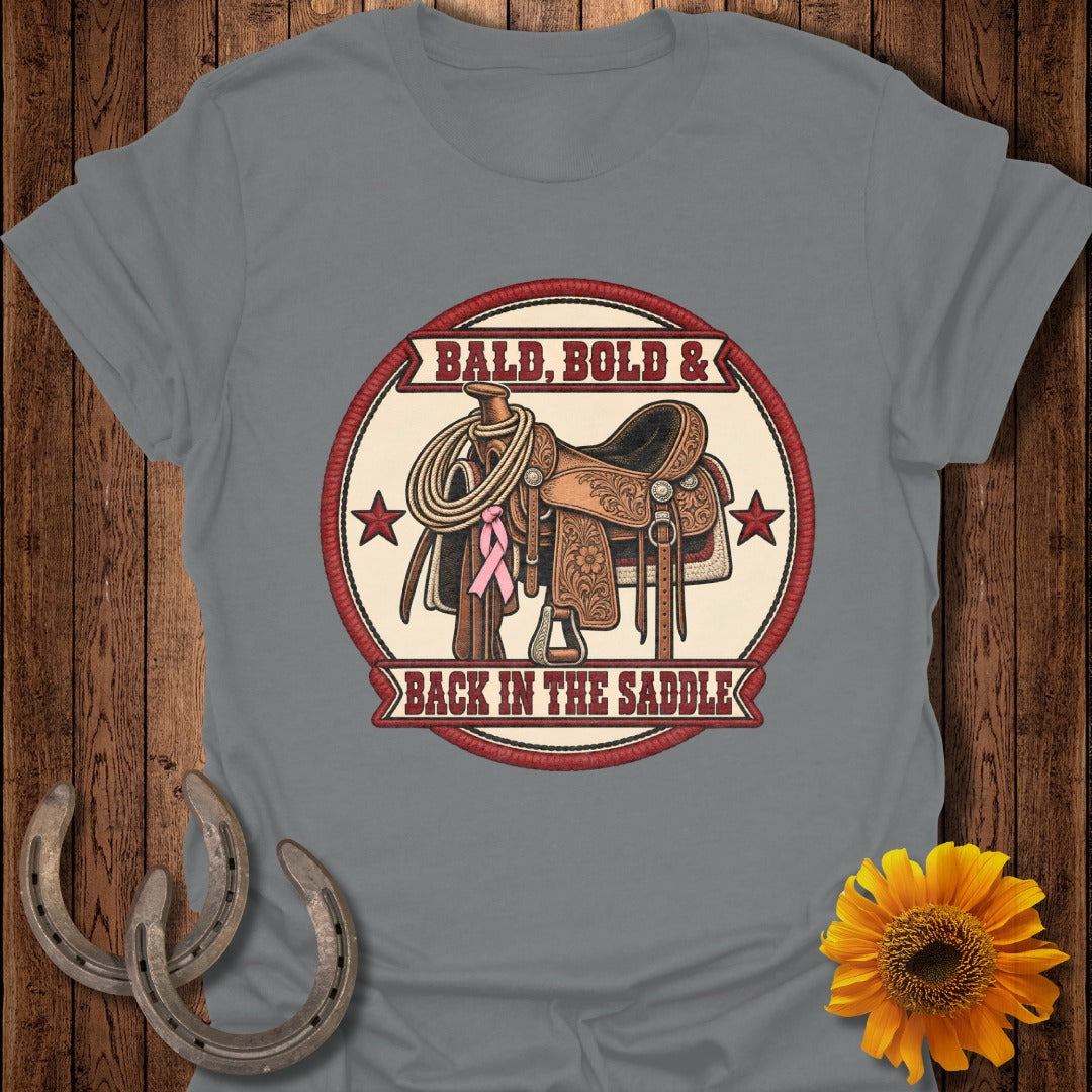 Western saddle with lasso and pink ribbon, reads "Bald, Bold & Back In The Saddle".