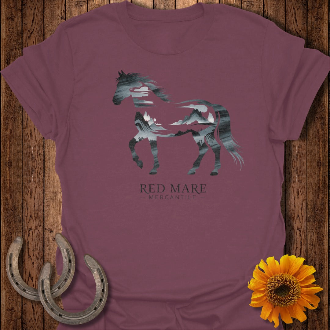 Maroon t-shirt with a grey horse silhouette filled with a mountain landscape.