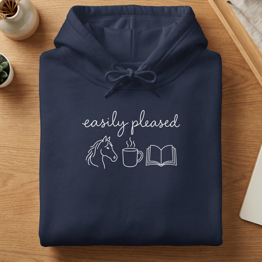 Navy hoodie with "easily pleased" text, horse, coffee cup, and book icons.