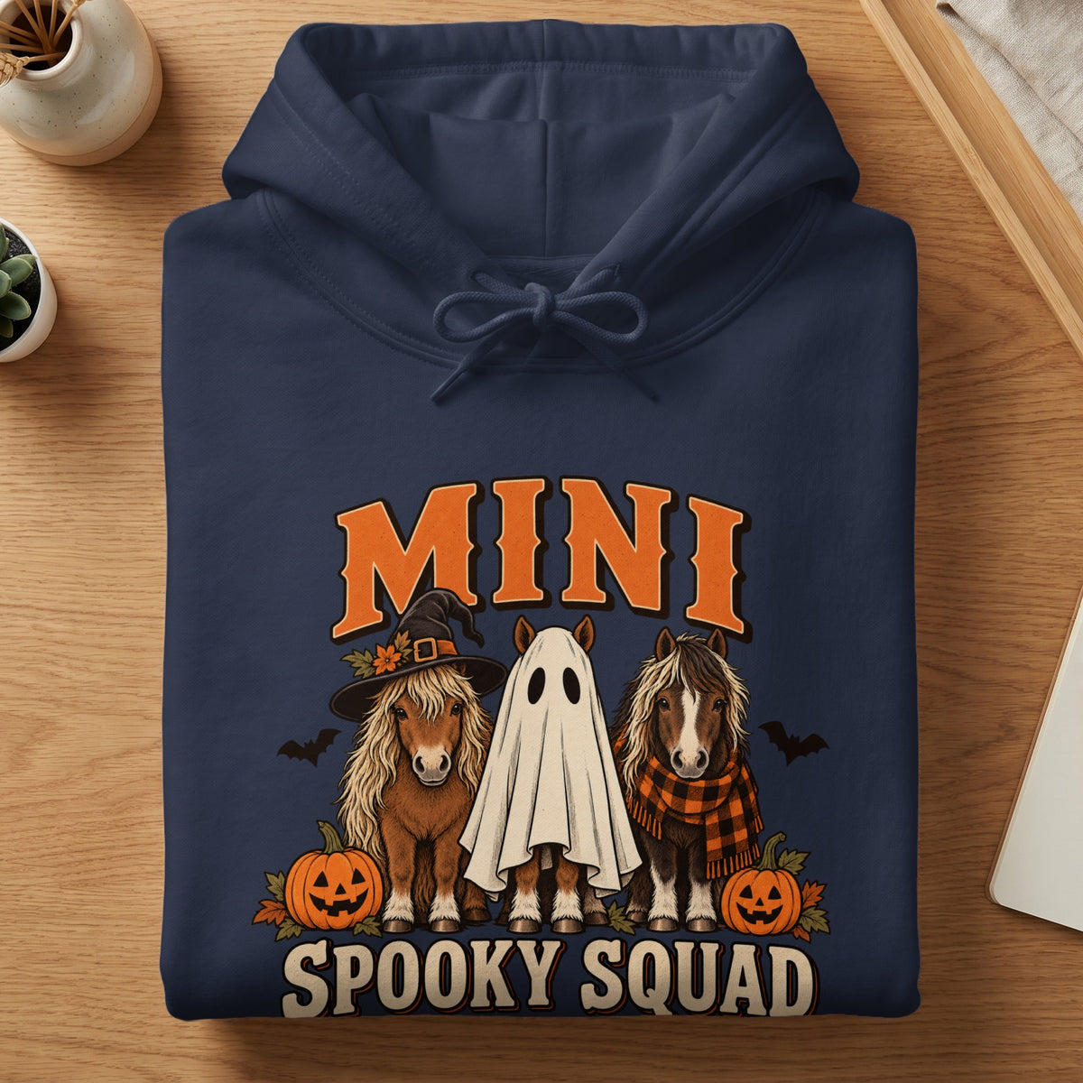 Navy hoodie with Halloween ponies, pumpkins, bats, and text "MINI SPOOKY SQUAD".