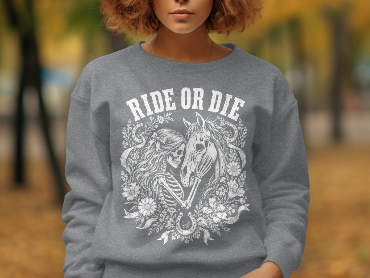 Grey sweatshirt with "RIDE OR DIE" graphic of skeleton, horse, and flowers.