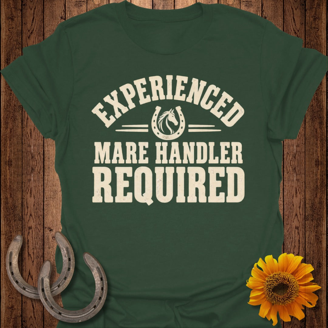 Green t-shirt with "Experienced Mare Handler Required" text and horseshoe graphic.