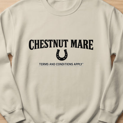 Cream sweatshirt with "CHESTNUT MARE" text and horseshoe graphic.