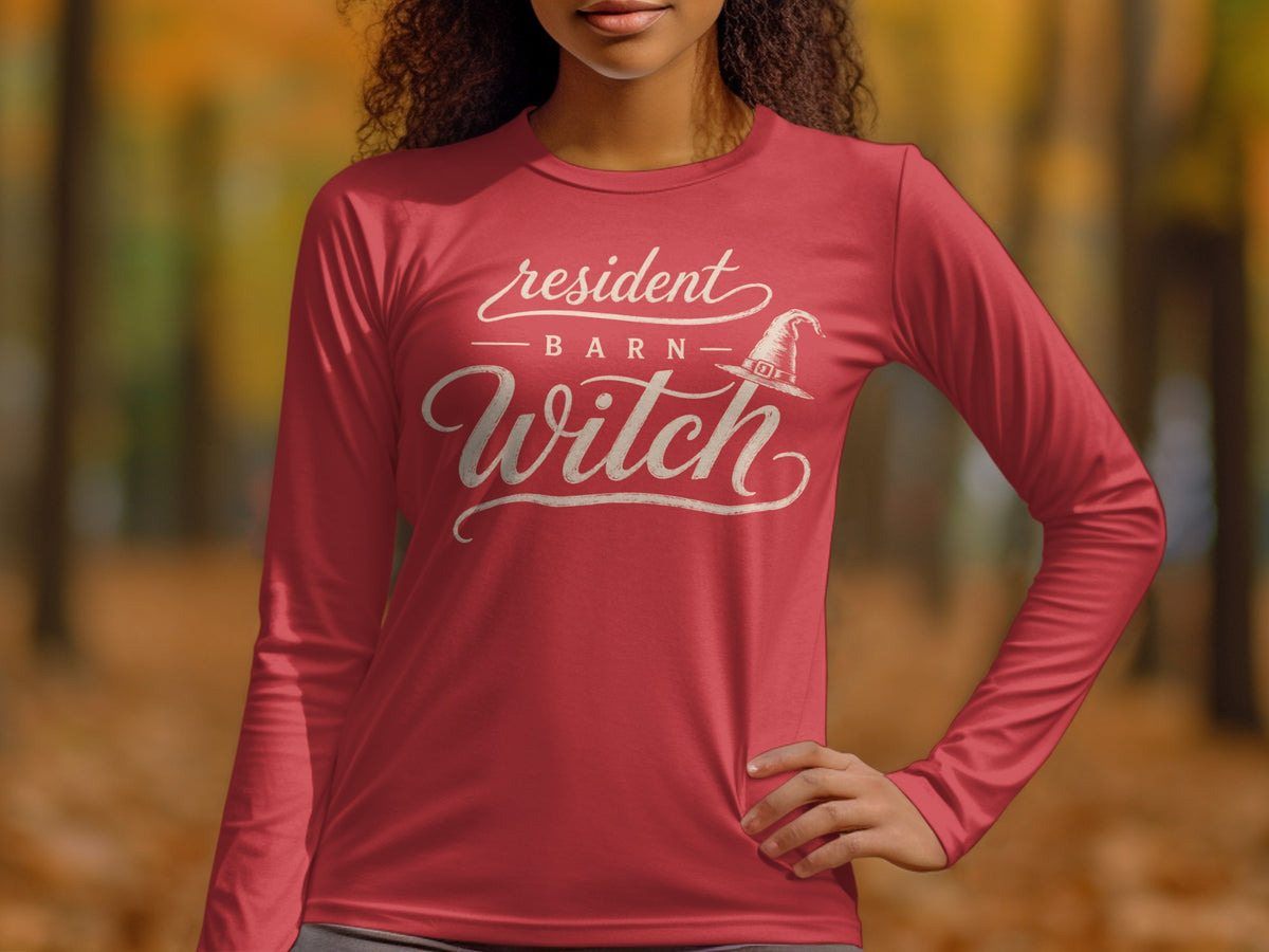 Red long sleeve shirt with "Resident Barn Witch" and a witch hat graphic.