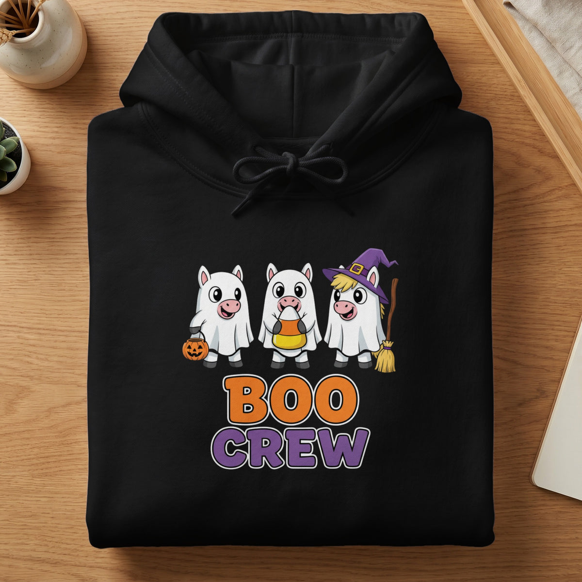 Black hoodie with "Boo Crew" text and three ghost-costumed unicorns.
