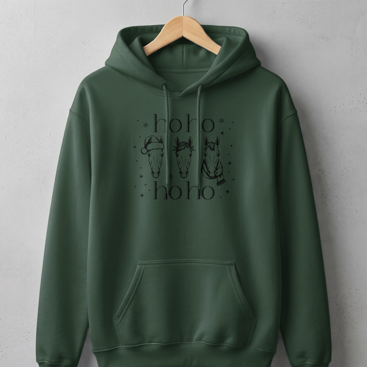 Dark green hoodie with a black graphic of three horses and "hoho" text.