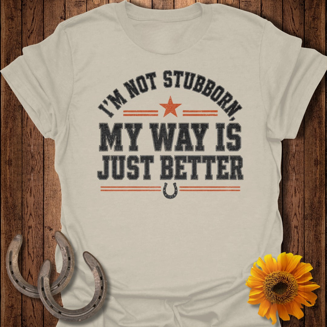 Cream t-shirt with text "I'm not stubborn, my way is just better" and horseshoe icon.