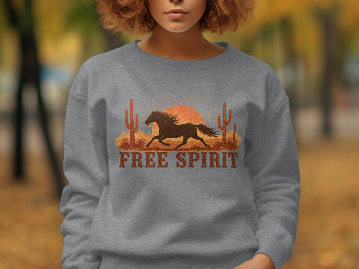 Crewneck sweatshirt with desert sunset graphic and "FREE SPIRIT" text.