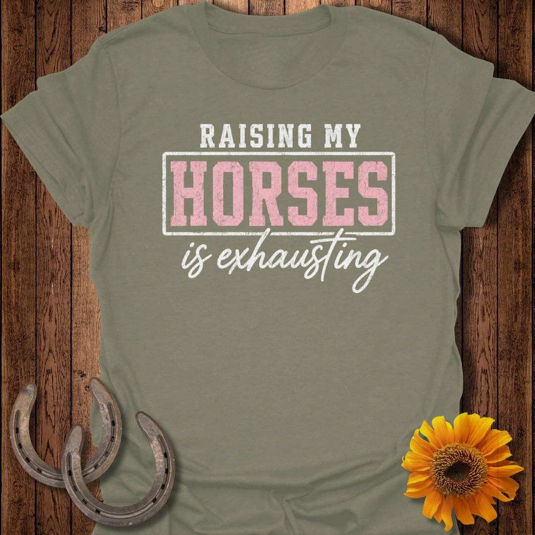 Green t-shirt with "Raising my horses is exhausting" text and horseshoes.