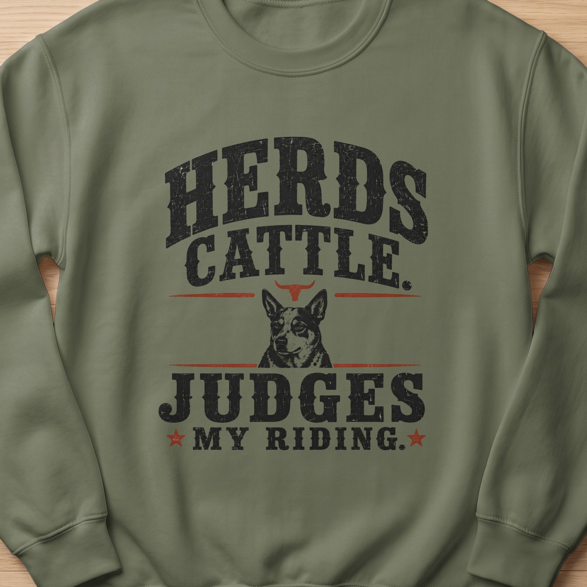 Herds cattle judges my riding dog graphic on a green crewneck sweatshirt.
