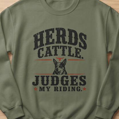 Herds cattle judges my riding dog graphic on a green crewneck sweatshirt.