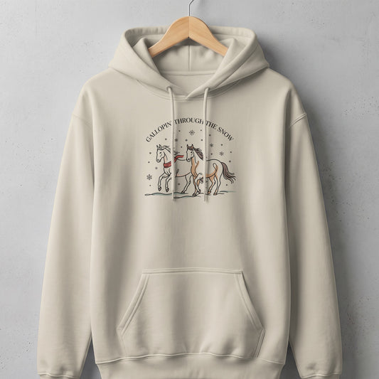 Beige hoodie with illustration of two horses and text "Gallopin' Through The Snow."
