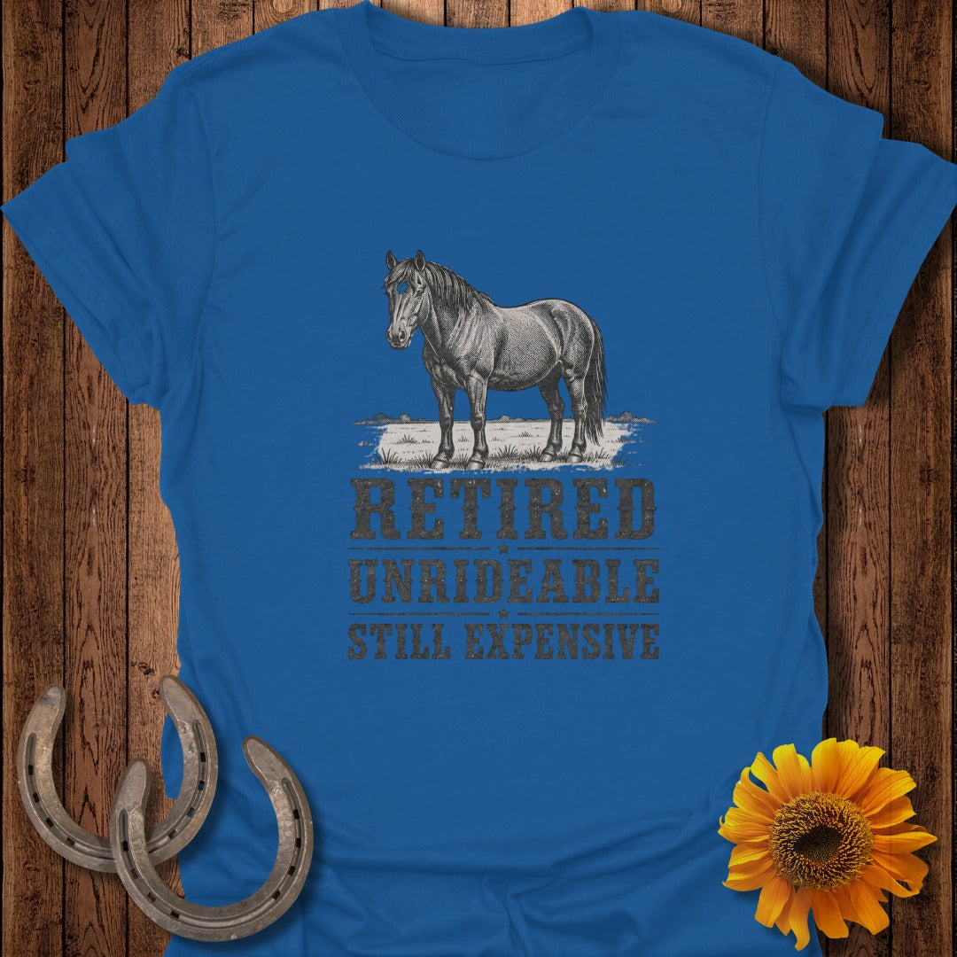 Royal blue t-shirt with a vintage horse illustration and text: Retired, Unrideable, Still Expensive.