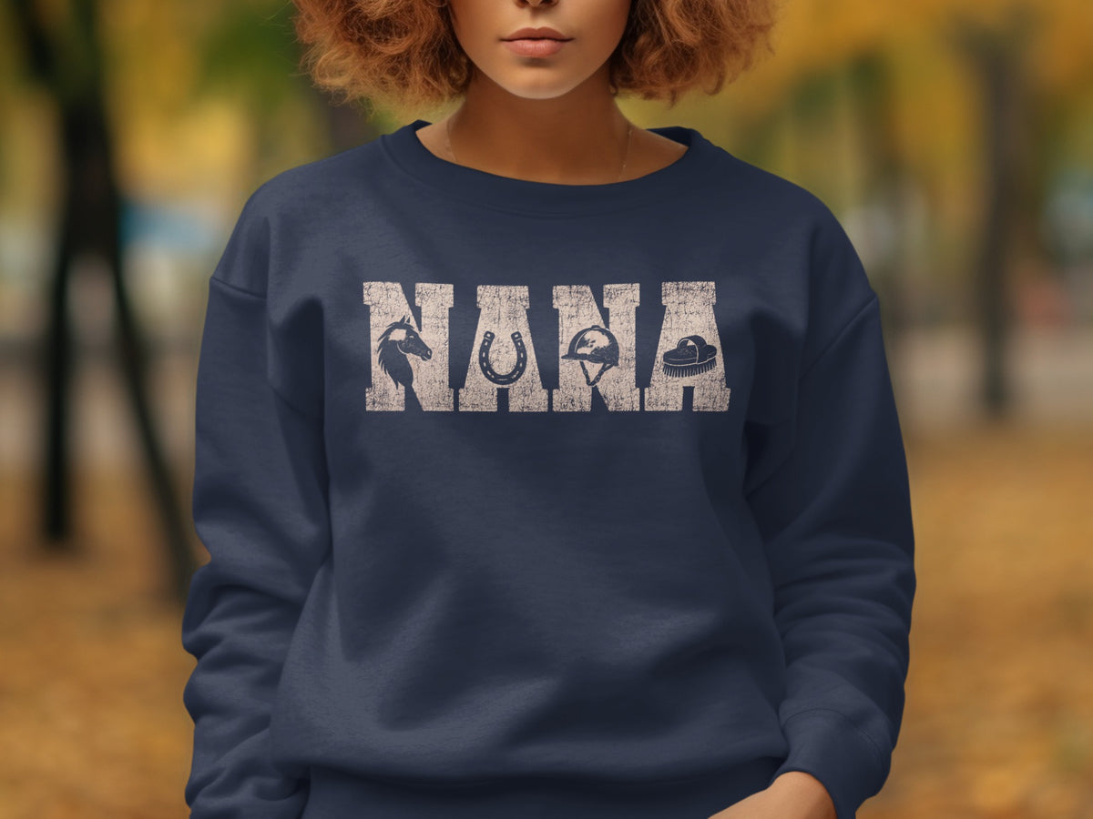 Navy sweatshirt with "NANA" text featuring horse, horseshoe, helmet, and brush graphics.