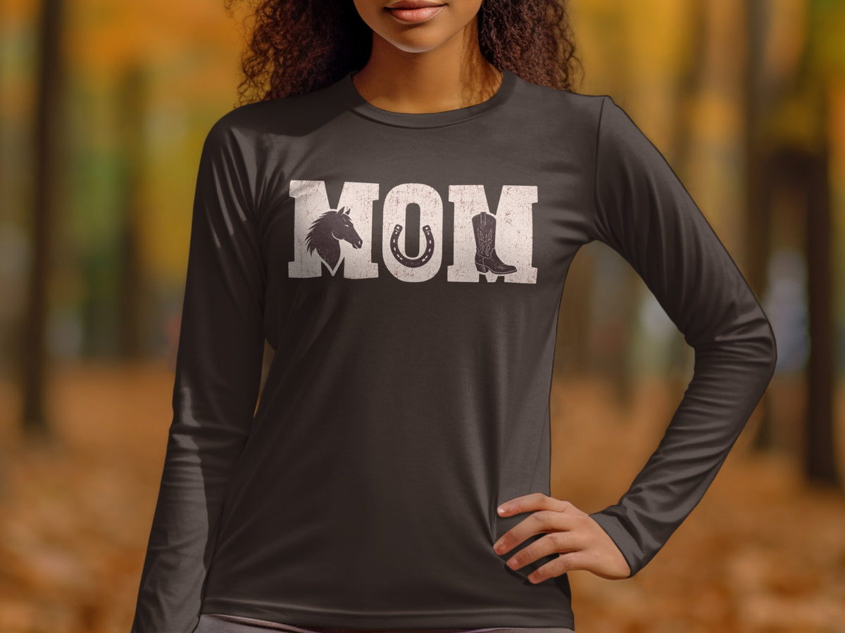 Long sleeve t-shirt with "MOM" graphic featuring horse, horseshoe, and cowboy boot.