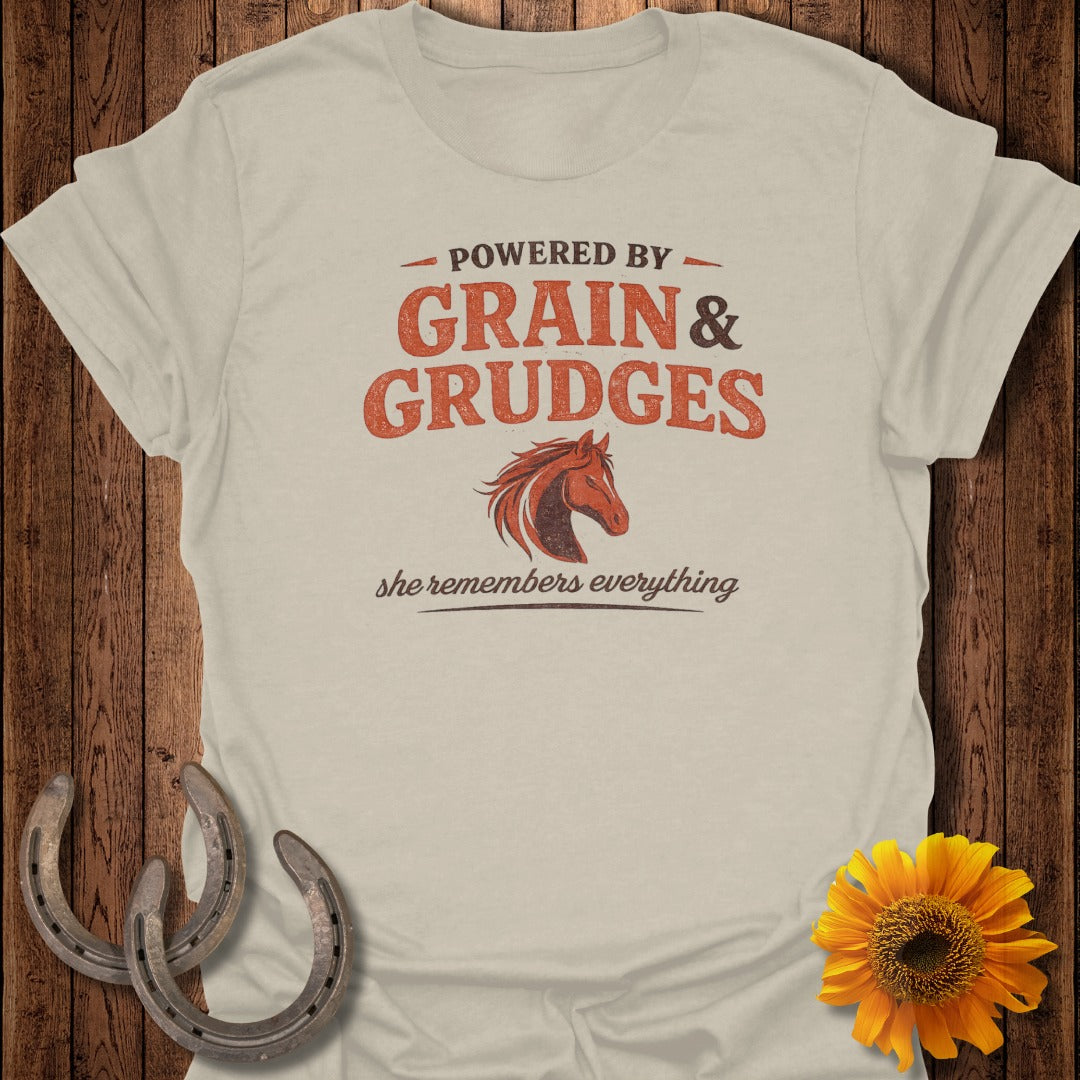 Beige t-shirt with "Powered by Grain & Grudges" and horse graphic.
