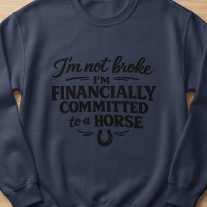 Navy sweatshirt with black text: "I'm not broke, I'm financially committed to a horse."