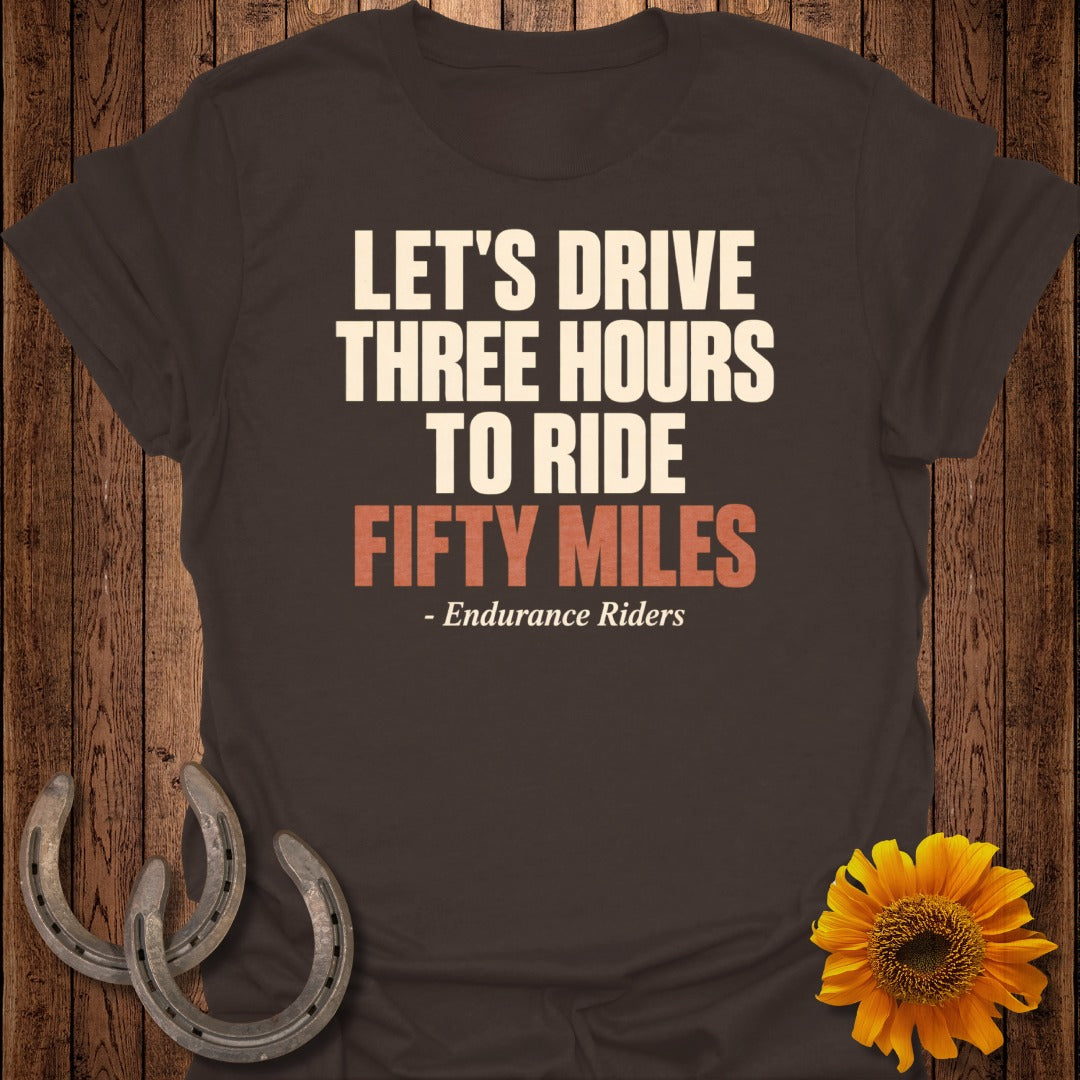 Brown t-shirt with white text "LET'S DRIVE THREE HOURS TO RIDE FIFTY MILES"