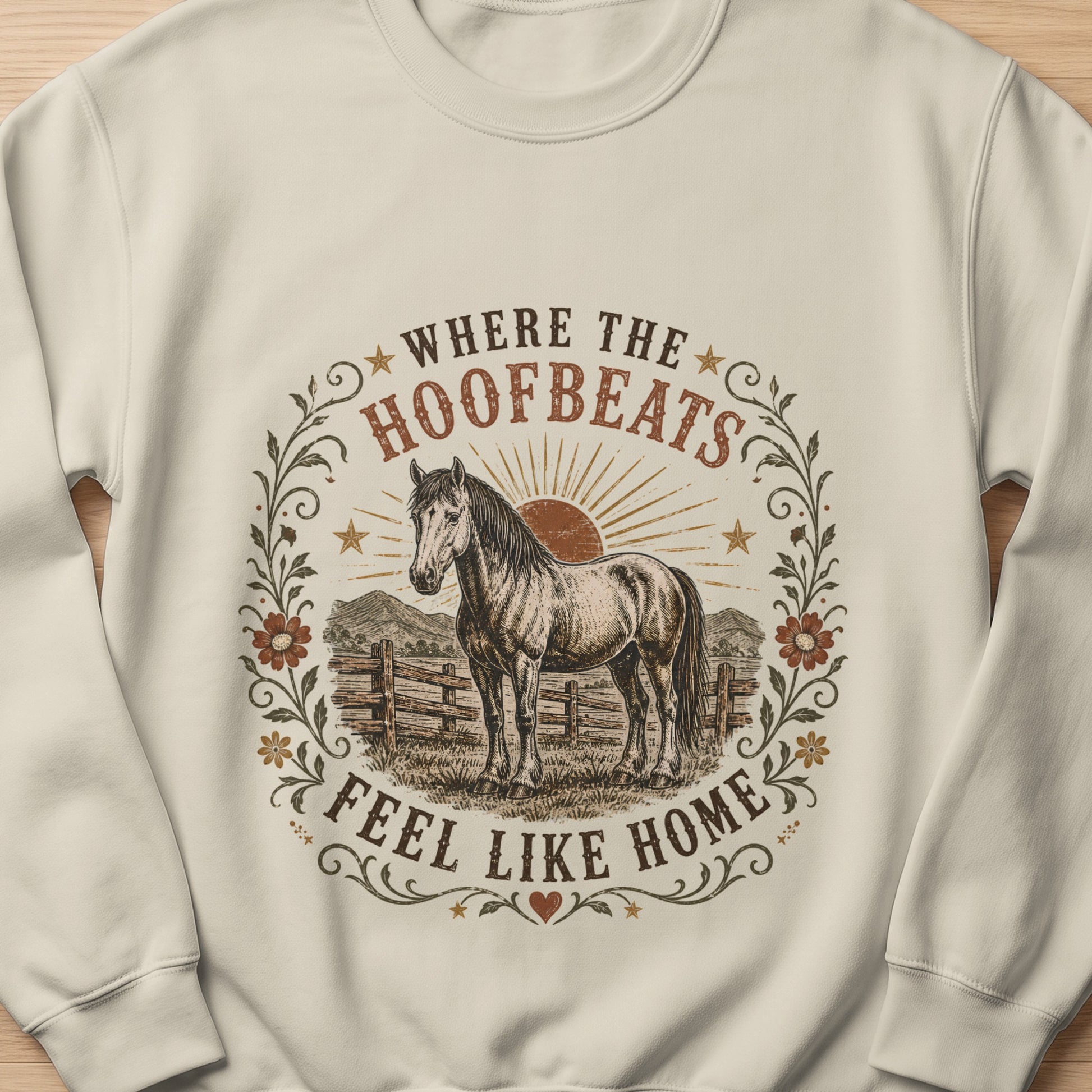 Cream sweatshirt with horse graphic and text "Where the Hoofbeats Feel Like Home."