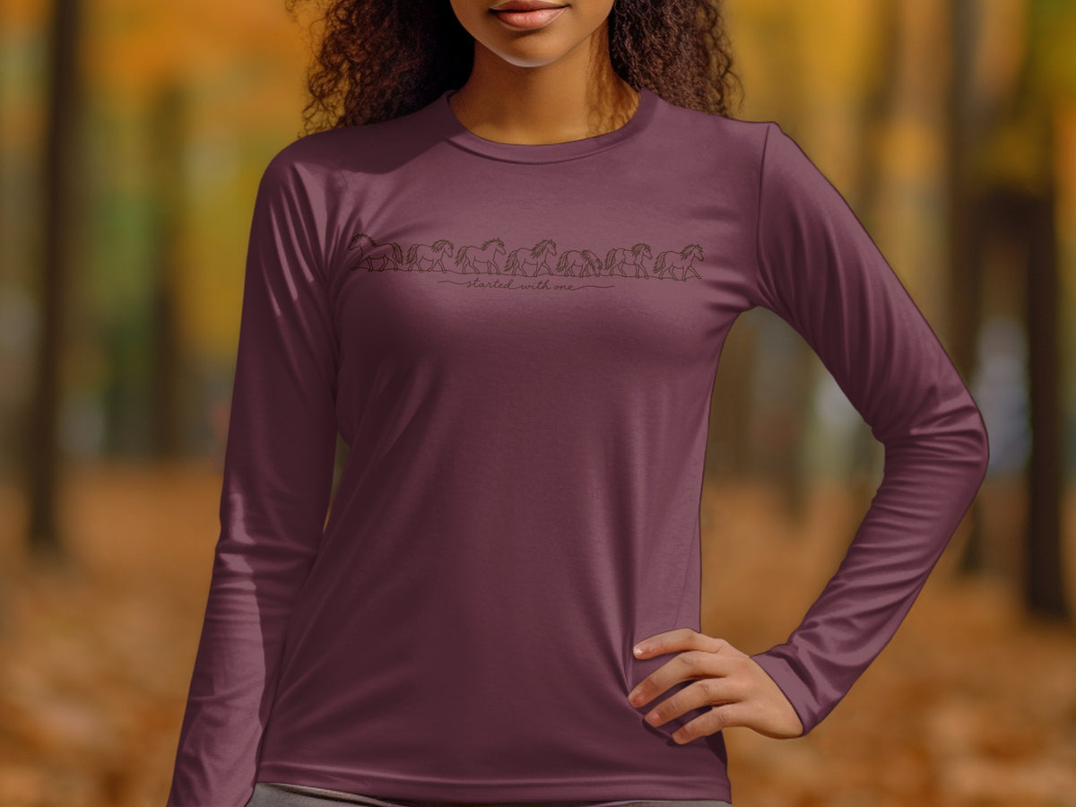 Maroon long-sleeve shirt with line drawing of horses and text "started with one".