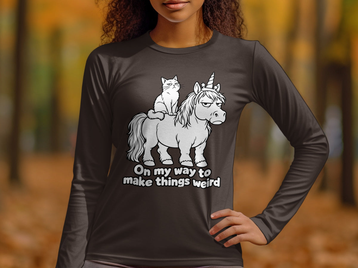 Dark grey long-sleeve shirt with a white cat on a grumpy unicorn graphic, text reads "On my way to make things weird".