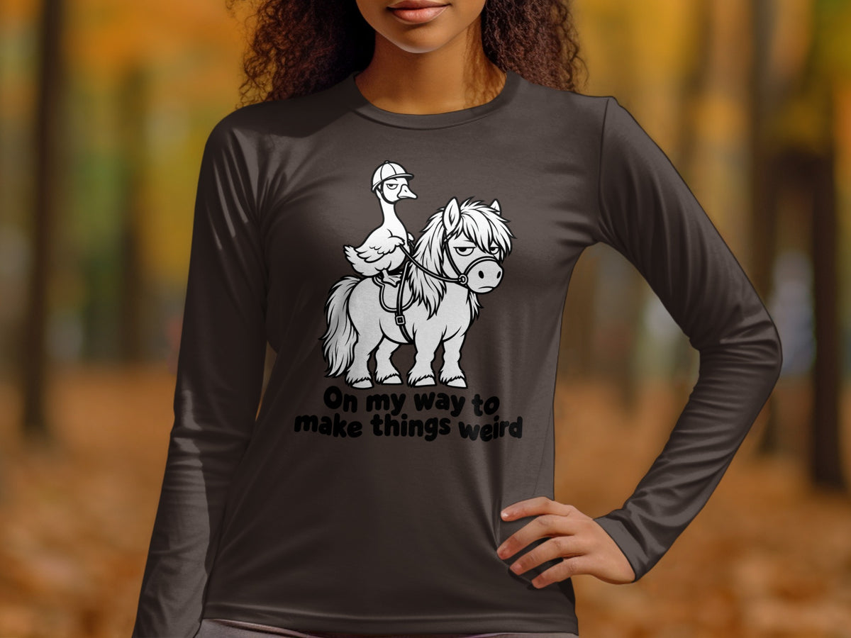 Dark long sleeve shirt with graphic of duck riding a pony, text "On my way to make things weird".