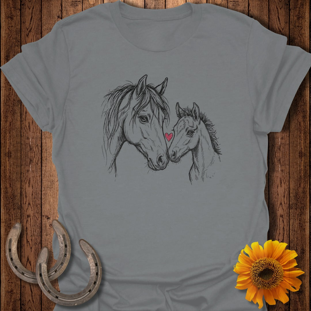 Sketch of a mother horse and foal with a small red heart on the foal's nose.