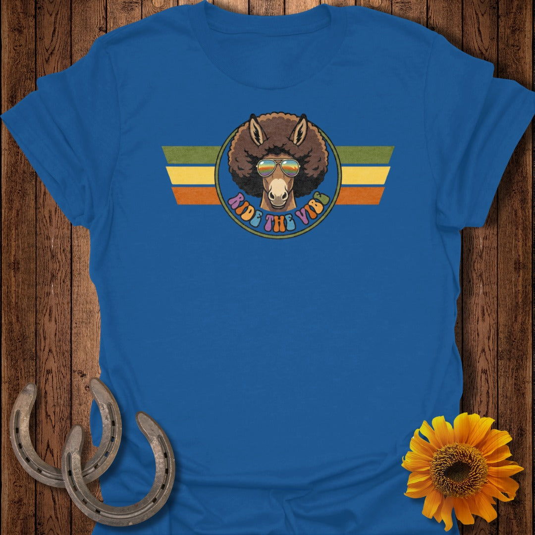 Blue t-shirt with a donkey wearing sunglasses and a colorful stripe emblem.