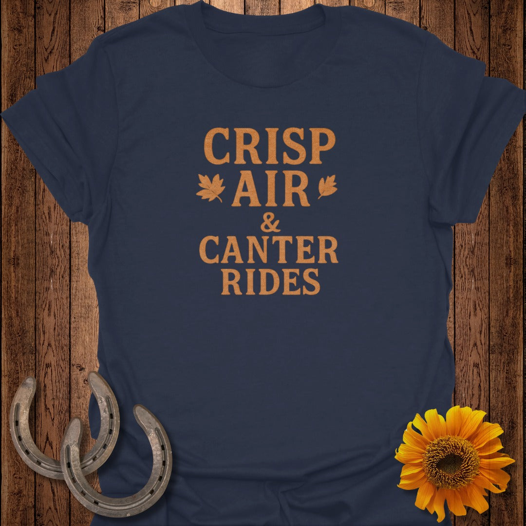 Navy t-shirt with orange text "CRISP AIR & CANTER RIDES" and autumn graphics.
