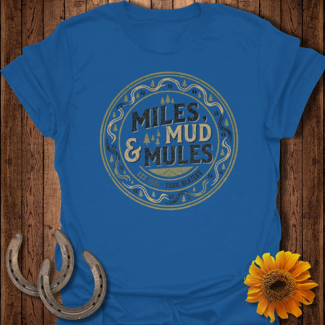 Blue t-shirt with "Miles & Mud Trail Blazers" circular logo.