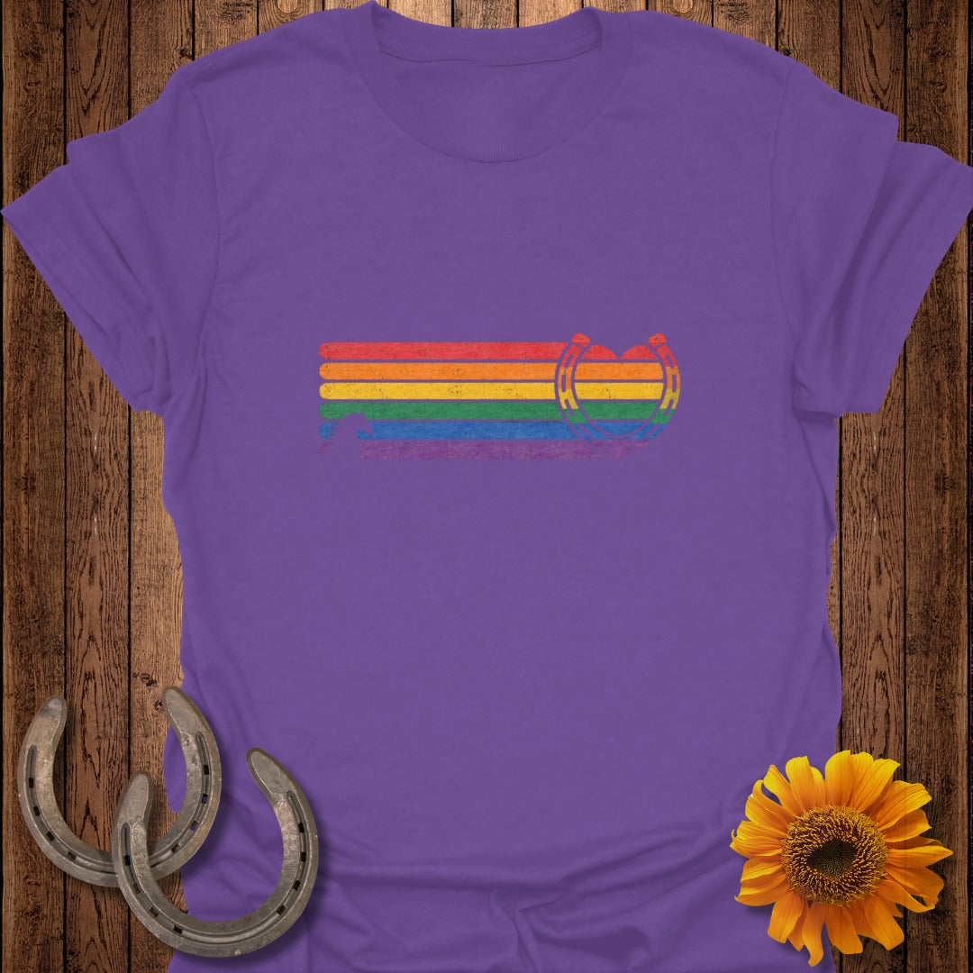 Purple t-shirt with rainbow stripes and horseshoes graphic.