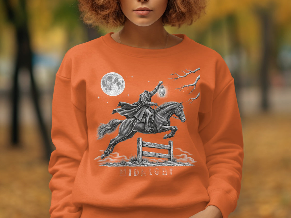 Orange sweatshirt with headless horseman, lantern, moon, and "MIDNIGHT" text.
